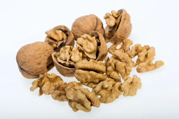 Walnut and a cracked walnut isolated on the white background — Stock Photo, Image