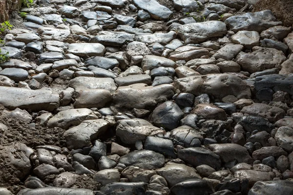 Pedras que pavimentam o fundo de textura antiga — Fotografia de Stock