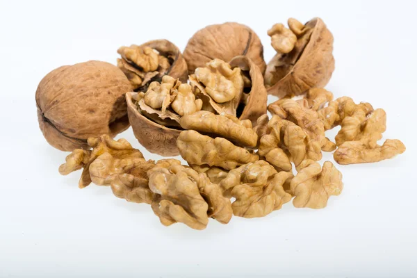 Walnut and a cracked walnut isolated on the white background — Stock Photo, Image