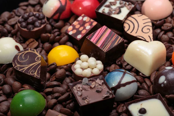 Set of a various chocolate pralines and coffee beans — Stock Photo, Image