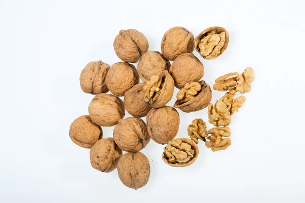 Walnut and a cracked walnut isolated on the white background — Stock Photo, Image