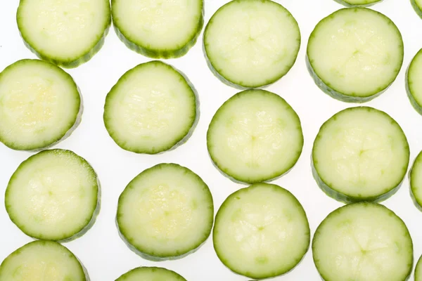 Freshly sliced cucumber  isolated on white background — Stock Photo, Image