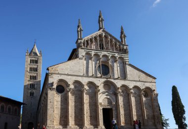 Massa Marittima, Italy - Sept 11, 2022:  the Cathedral of Saint Cerbonius with Bell tower at the Garibaldi square in Massa Marittima. Italy