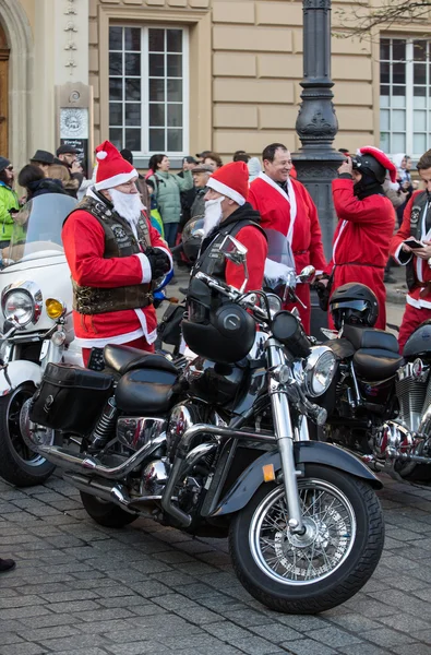 The parade of Santa Clauses on motorcycles around the Main Market Square in Cracow. — Stock Photo, Image