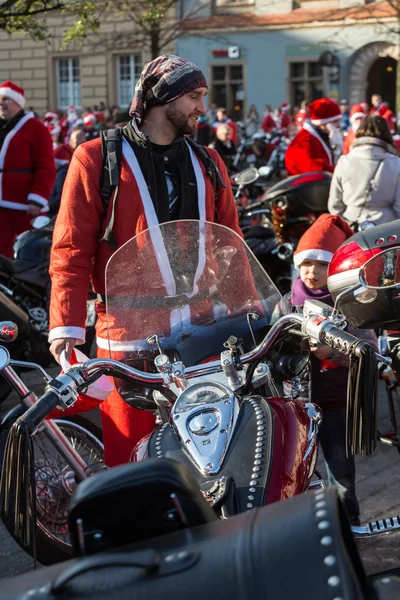 The parade of Santa Clauses on motorcycles around the Main Market Square in Cracow. Poland — Stock Photo, Image