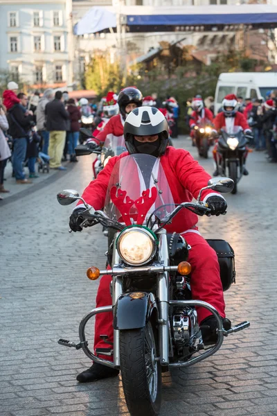 The parade of Santa Clauses on motorcycles around the Main Market Square in Cracow. Poland — Stock Photo, Image