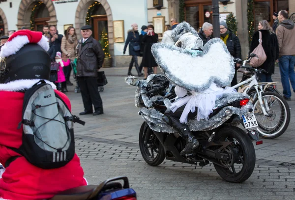 the parade of Santa Clauses on motorcycles around the Main Market Square in Cracow. Poland