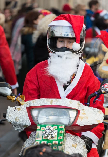 The parade of Santa Clauses on motorcycles around the Main Market Square in Cracow. Poland — Stock Photo, Image