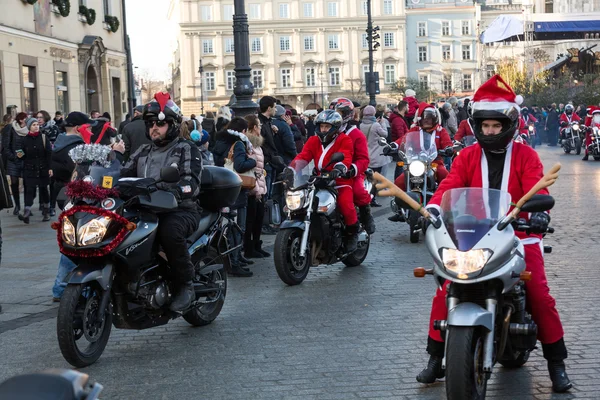 The parade of Santa Clauses on motorcycles around the Main Market Square in Cracow. Poland — Stock Photo, Image
