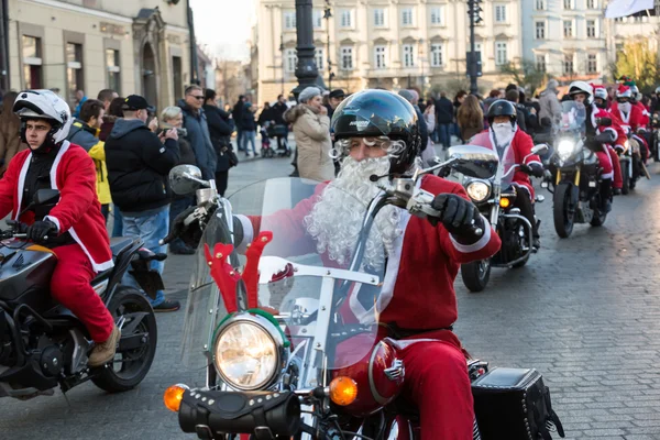 The parade of Santa Clauses on motorcycles around the Main Market Square in Cracow. Poland — Stock Photo, Image