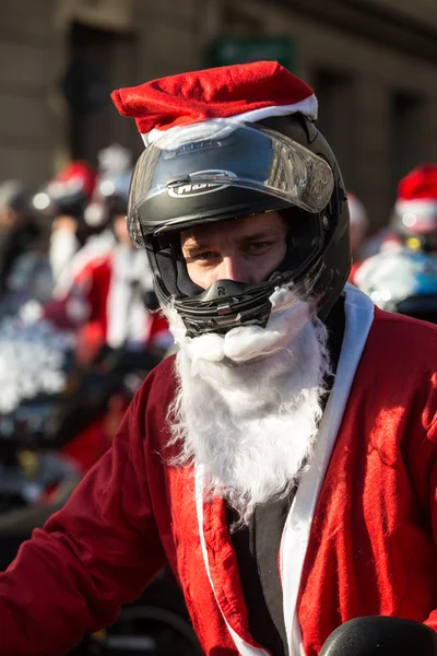 The parade of Santa Clauses on motorcycles around the Main Market Square in Cracow. Poland — Stock Photo, Image