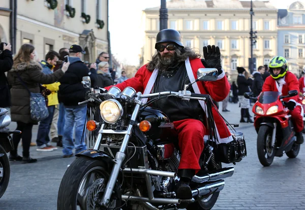 the parade of Santa Clauses on motorcycles around the Main Market Square in Cracow. Poland