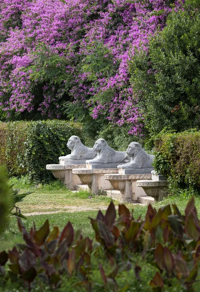 Lion sculpture in Garden of Villa Borghese. Rome, Italy
