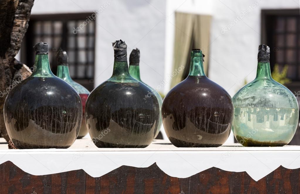 A big bottles with grape wine - malvasia.  Lanzarote, Spain