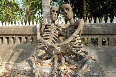 Sculpture of skeletons in Buddha Park clipart