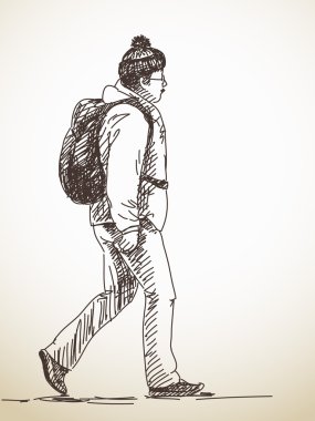 Sırt çantası ile yürüyen adam