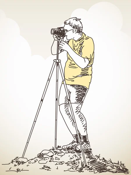 Fotógrafo com tripé tirando foto — Vetor de Stock