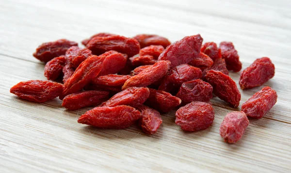 Heap of Dry Goji Berries on the Wooden Table — Stock Photo, Image