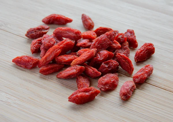 Heap of Dry Goji Berries on the Wooden Table — Stock Photo, Image