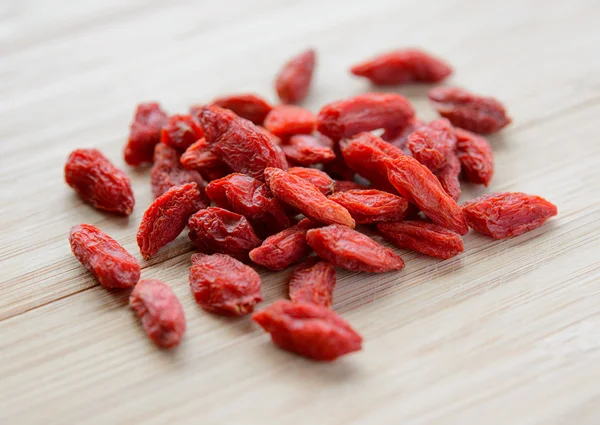 Heap of Dry Goji Berries on the Wooden Table — Stock Photo, Image