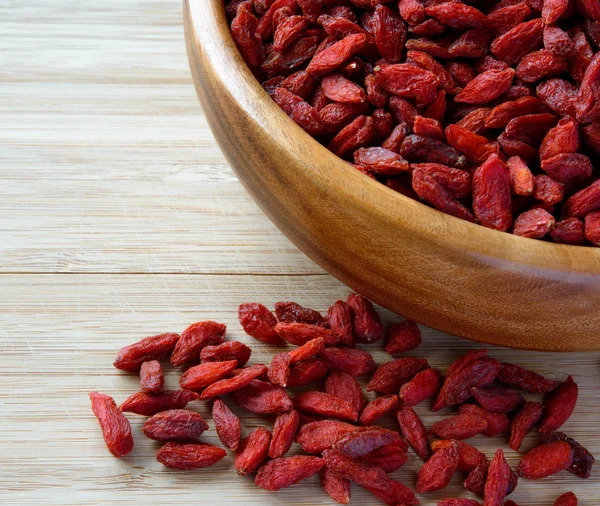 Wooden Bowl Full of Dried Goji Berries on the Table — Stock Photo, Image