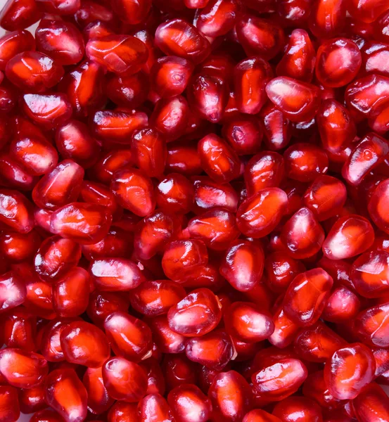 Fondo lleno de semillas de granada roja — Foto de Stock