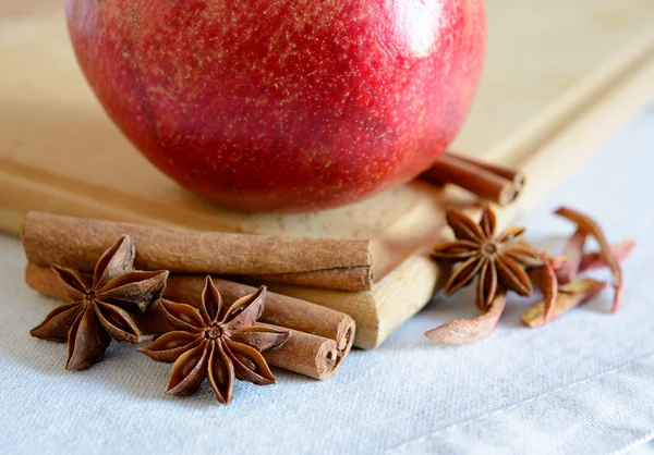 Red Pomegranate with Spaces on the Wooden Cutting Board — Stock fotografie