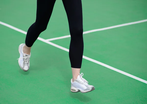 Woman Athlete Runner Feet Running on Green Running Track. Fitness and Workout Wellness Concept. — 图库照片