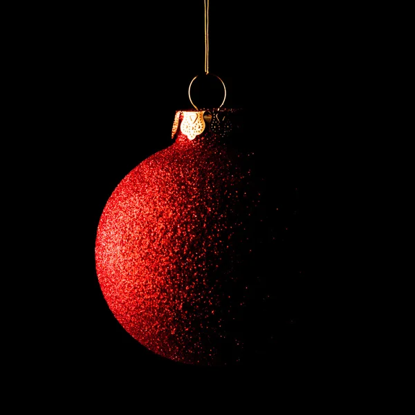 Red Christmas Ball on Black Background. Greeting Card — Stock fotografie