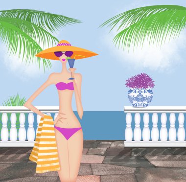 Bir içki tutan şık genç kadın bir bikini 