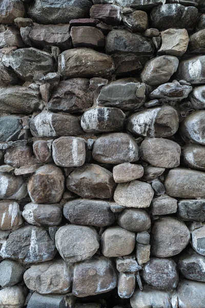 Texture of a stone wall. Old castle stone wall texture background. Stone wall as a background or texture. Part of a stone wall, for background or texture.
