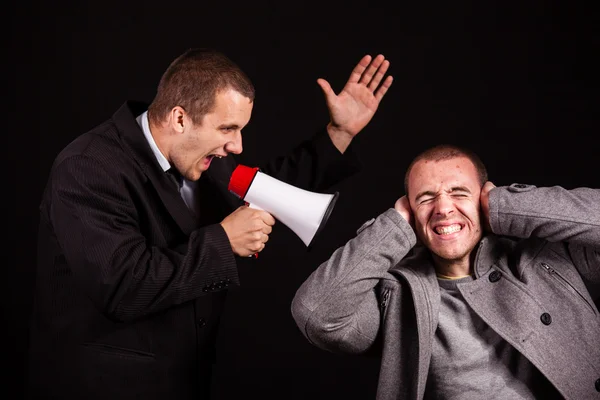 Businessman screaming in megaphone — Stock Photo, Image