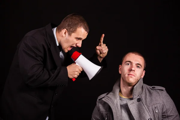 Businessman screaming in megaphone — Stock Photo, Image