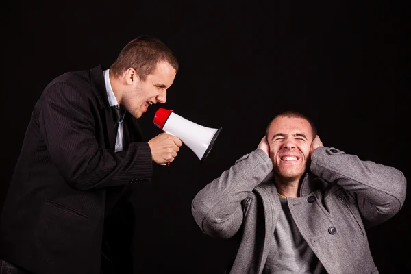 Businessman screaming in megaphone — Stock Photo, Image