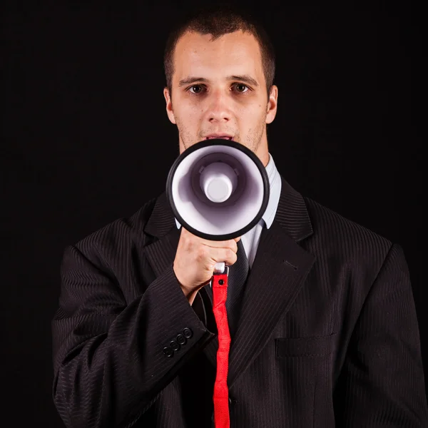 Businessman screaming in megaphone — Stock Photo, Image
