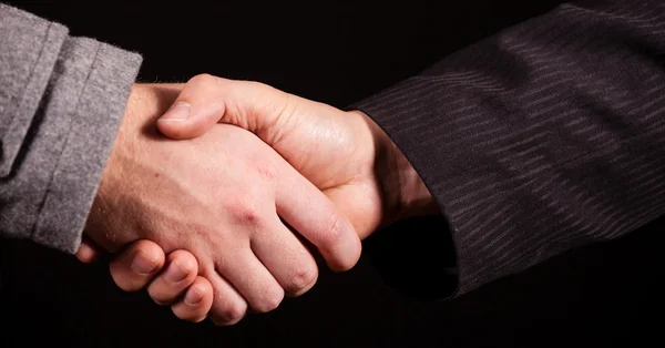 Affari handshake oltre nero — Foto Stock