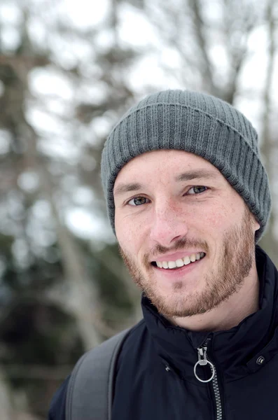 Portrait of a young beard man  in a cap — Stock Photo, Image