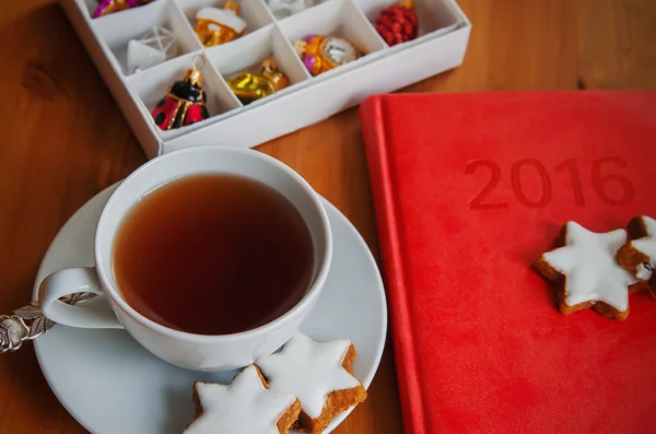 Tea with cake , diary and Christmas decoration — Stock Photo, Image