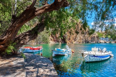 Boats on Lake Voulismeni. Agios Nikolaos, Crete, Greece clipart