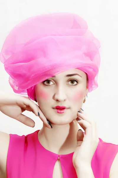 Beautiful woman in a pink hat and dress — Stock Photo, Image