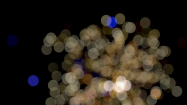 Foto de luzes bokeh no fundo preto — Fotografia de Stock