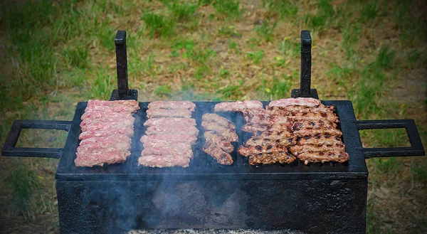 Cevapcici on a grill — Stock Photo, Image