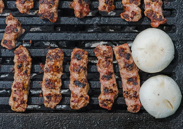 Cevapcici and Champignongs on a grill — Stock Photo, Image