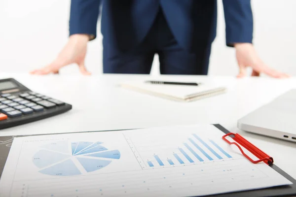 businessman working alone in the office. Cropped image of male accountant working with papers