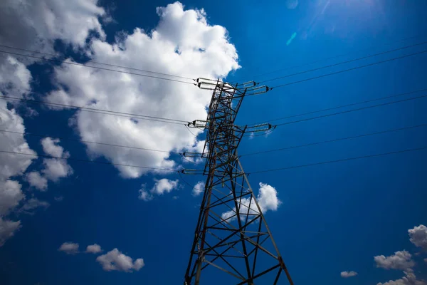 Electricity is the major energy of the world. High voltage post. High voltage tower sky background. Aerial industrial background group of transmission towers.