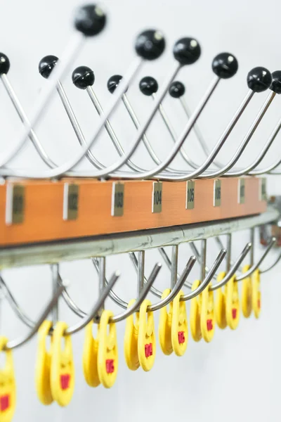 Number written on tag hanging in checkroom. — Stock Photo, Image