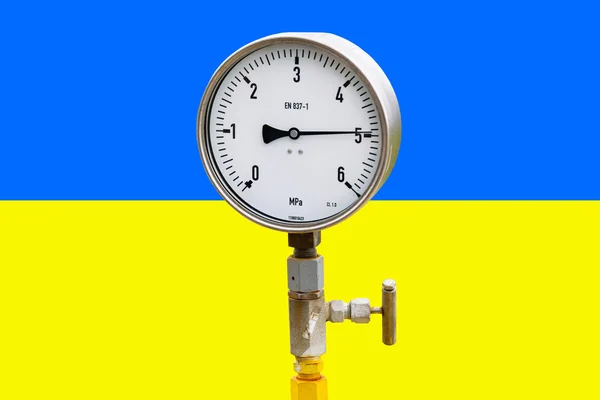 Brunnendruckmessgerät an der ukrainischen Flagge — Stockfoto