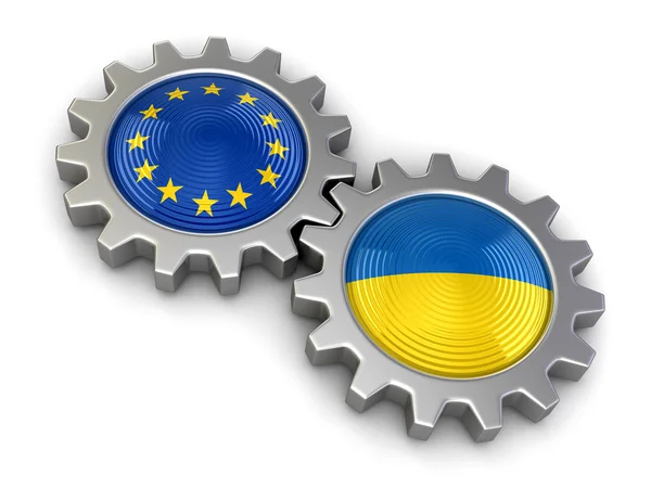 Drapeaux ukrainiens et de l'Union européenne sur un engrenage (chemin de coupe inclus ) — Photo