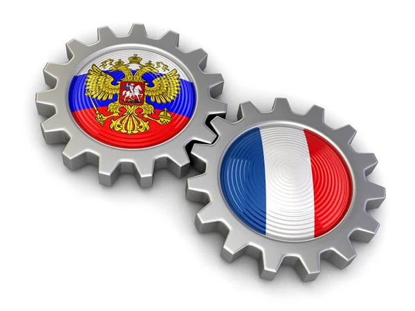 Drapeaux russes et français sur un engrenage (chemin de coupe inclus ) — Photo