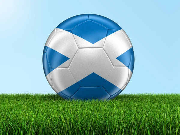 Fútbol con bandera escocesa sobre hierba — Foto de Stock